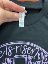 Load image into Gallery viewer, He Is Risen Typography in Lavender on a Bella Canvas 100% Cotton Size M
